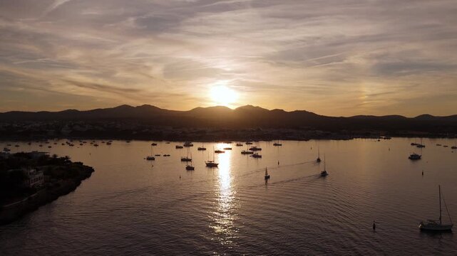 Aerial view of sailboats anchored at sunset in mallorca, Porto Colom