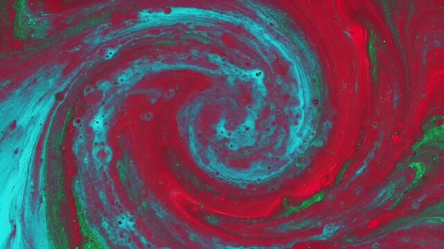 Abstract swirl of red and turquoise liquid creating a dynamic vortex pattern