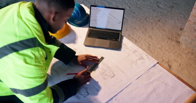 Man, architect or writing with blueprint or laptop for construction planning or building design. Top view, male person or contractor with floor layout for civil engineering or architecture project