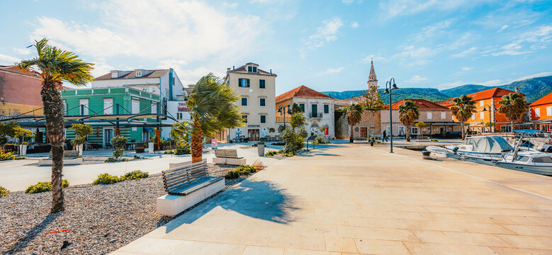 Jelsa town on Hvar island, with traditional Dalmatian stone architecture and boats moored in the harbor, Croatia.