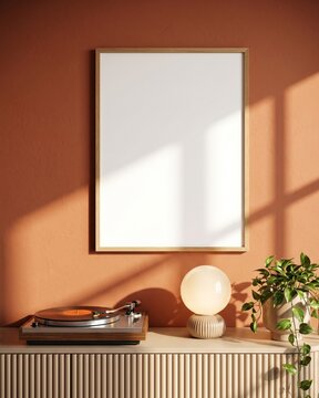 Blank wood frame mockup on terracotta wall above fluted cabinet with vinyl record player