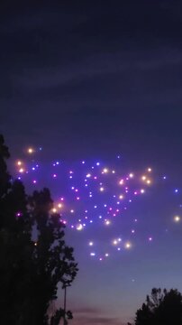 illuminated drones at night, drone show