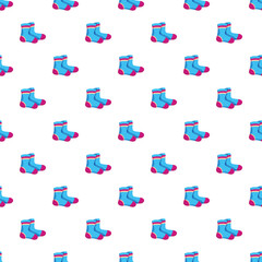 Naklejka premium Blue baby socks forming a repetitive pattern on a white background
