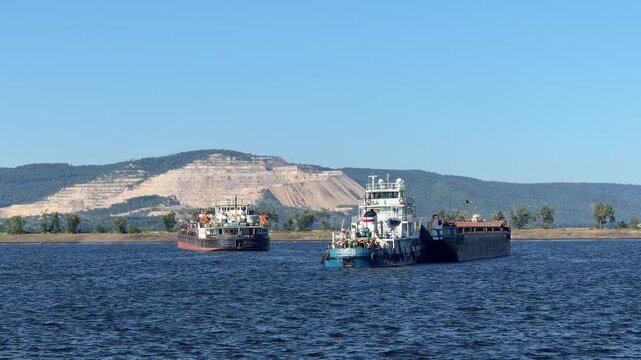 tanker barges docked at the port in Tolyatti, Russia. These floating storage units are key to inland waterway logistics.