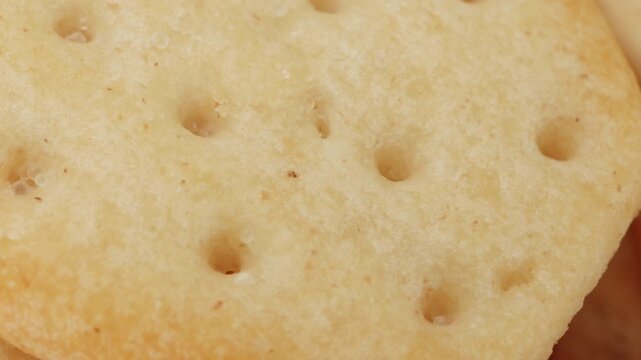 Cracker biscuit close up rotating camera motion stock footage