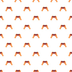 Hands holding a video game controller creating a repeating pattern for gaming and entertainment © nsit0108