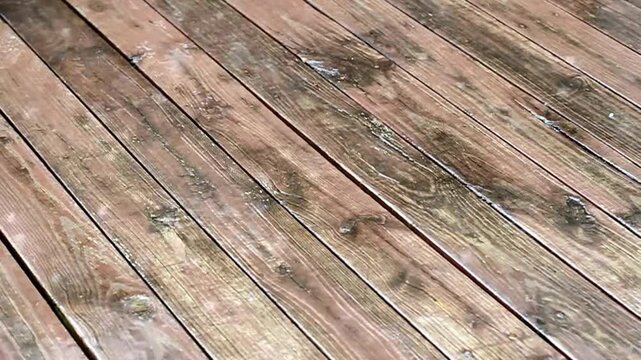 Weathered wooden deck boards with visible grain and texture