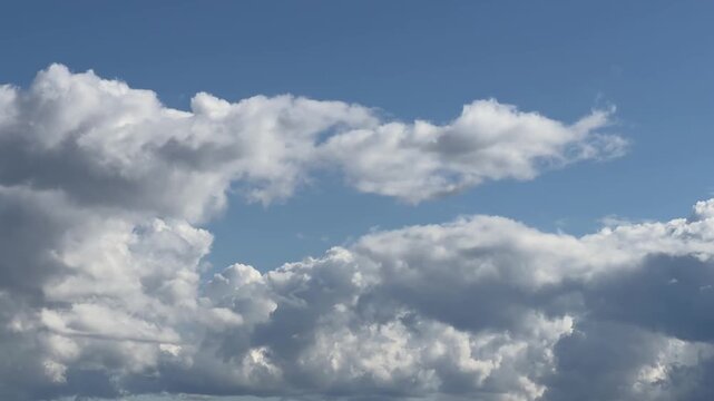 Dynamic cloudy sky in motion with soft blue tones
