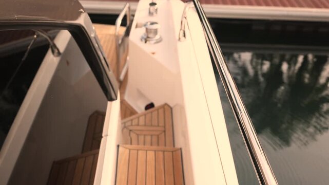 Luxury yacht teak wood deck planks with exterior first person view of yacht