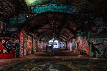 Colorful street art inside the Leake Street graffiti tunnel in London © Sho