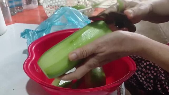 Close Up Hands Peeling Winter Melon Before Cooking Traditional Soup
