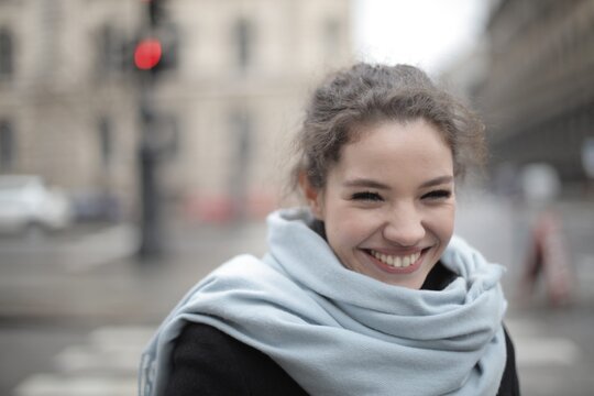 Happy young woman with a big smile outdoors