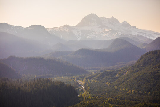 Soft golden light over a hazy mountain range