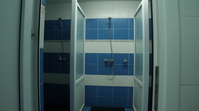 Three simple shower cabins in public place like hospital, hostel or shelter.