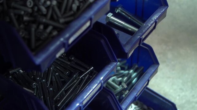Screw nut organizer different sizes in repair workshop on factory plant.