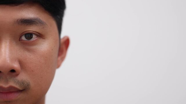 Close up man eye black color,Detail face and eye of asian man