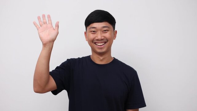 Asian man standing and show hand bye bye, Man say good bye concept