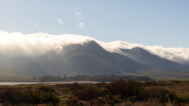 clouds descending on Klein Mountains and Lagoon, Stanford, South Africa