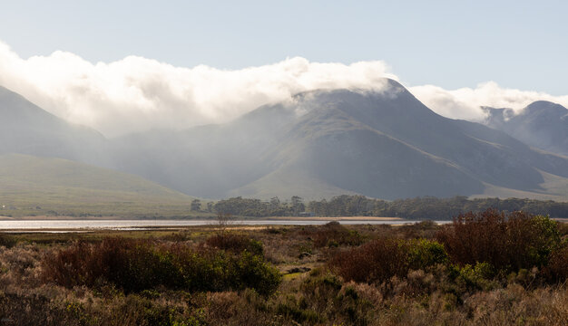 clouds descending on Klein Mountains and Lagoon, Stanford, South Africa