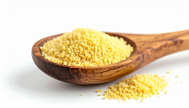 Couscous grains in wooden spoon, isolated on white background, fine granular texture, culinary ingredient presentation. Close-up.