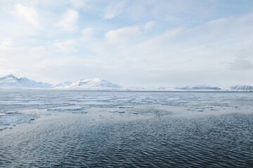 Arctic Sea Ice Landscape with Snow Covered Mountains © Sjoerd