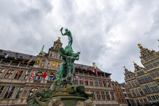 ANTWERP, BELGIUM, JULY 16, 2025 - The famous Brabo Fountain in the center of the splendid Grote Markt square in Antwerp, Belgium. It was made of bronze by the sculptor Jef Lambeaux in 1887.