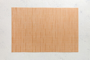 Fototapeta premium Top view of light tablecloth for food on cement background. Empty space for your design