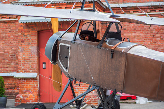 Vintage World War I single engine airplane with wooden propeller and plywood structure, early aviation