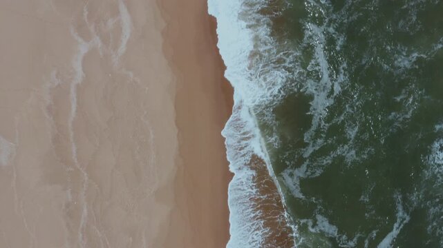 Drone Aerial View of Playa Garzon Beach with Turquoise Waves and Colorful Shoreline