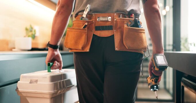 Plumber, hands and walk in kitchen with toolbox, maintenance job or repair skills for home renovation. Back, man or technician inspection in house with utility belt, DIY equipment or plumbing service