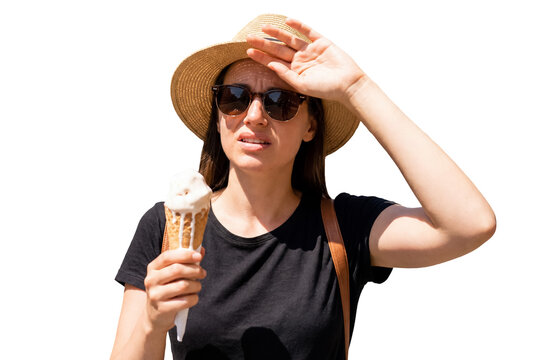 Woman wearing straw hat and sunglasses shielding eyes from sun while holding melting ice cream cone