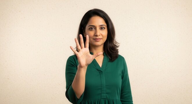 Woman holding up five fingers, counting, smiling