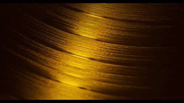 golden Vinyl record rotating in a macro shot