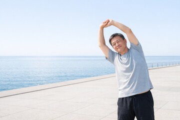 Asian man practicing summer outdoor fitness by seaside with clear sky © dvoevnore