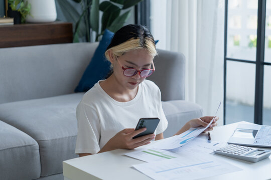 Young Asian Woman Holding Paying Bills on Mobile App