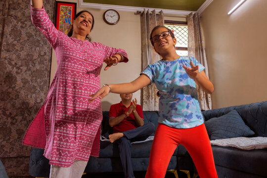 moment captured of mother and daughter dancing 