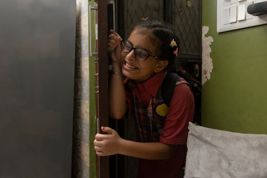 girl smiling with joy before leaving for school