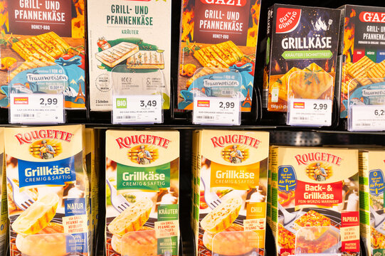 Grilling and frying cheese, Rougette and Gazi brand, marinated with herbs and spices, food, buying grocery, supermarket shelf in Trier, Germany