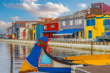Traditional moliceiro boats moored on the central canal of Aveiro, Portugal © f11photo