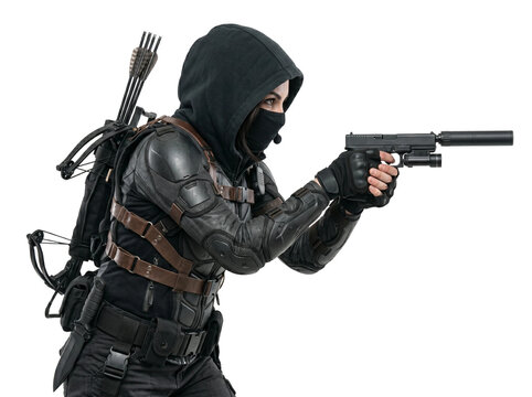 Tactical female fighter wearing a black hooded outfit and protective armor gear holds a silenced pistol with both hands while carrying a crossbow on her back against a clean white studio background se