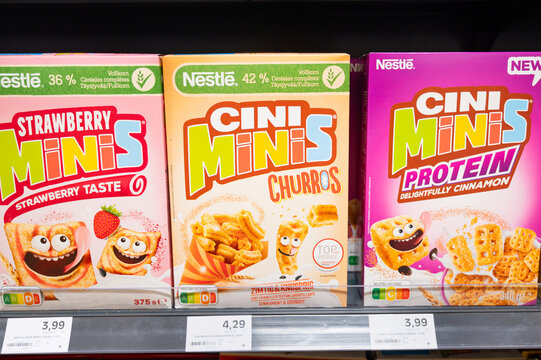 Nestle cereal muesli assortment, cinnamon churros and fruit flavour at store shelf, supermarket in Trier, Germany