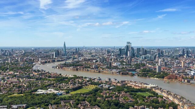 Panoramic time lapse view of the London skyline along the river Thames from London Bridge until the City during a sunny summer day, United Kingdom
