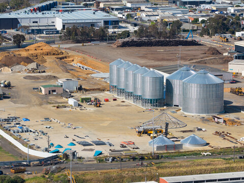 Aerial view of storage silos under construction in an industrial area