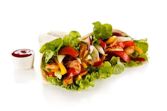 Kebab - grilled meat and vegetables on white background
