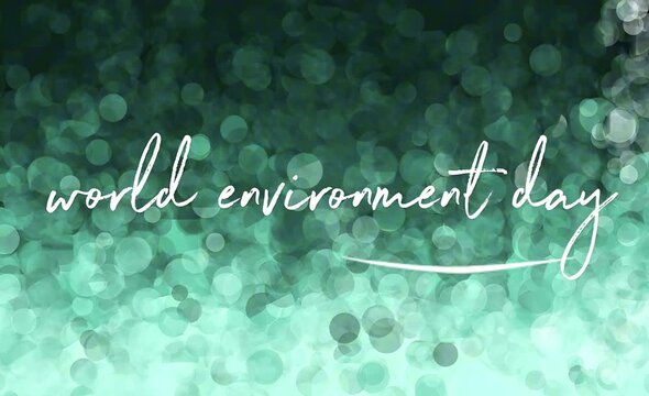 A visually appealing green bokeh background with elegant world environment day text, embodying the spirit of global ecological preservation and sustainable practices