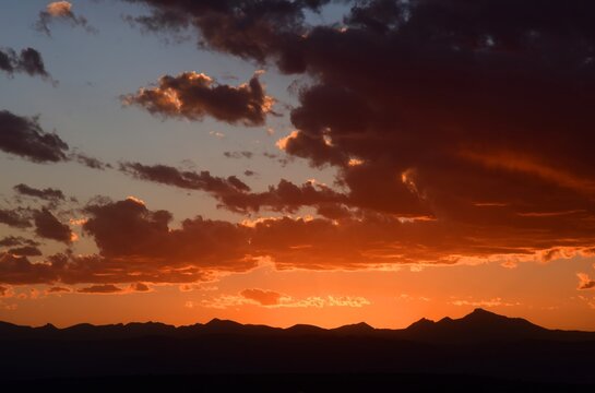 colorful summer sunset  over long's peak and  the front range of the colorado rocky mountains, from broomfield,  colorado 