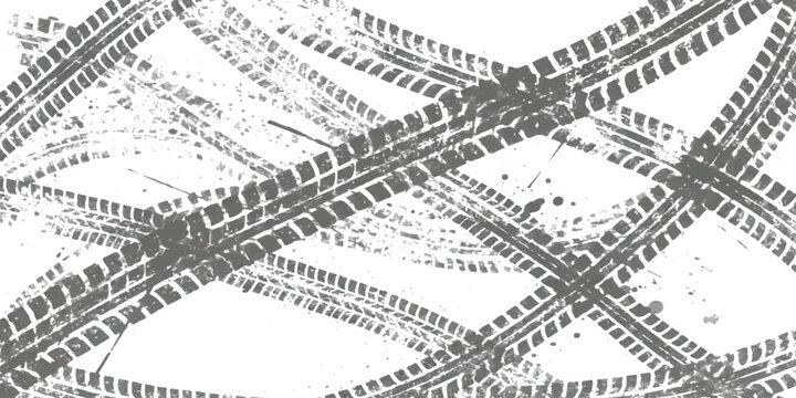 Black tire tracks crossing on a flat surface