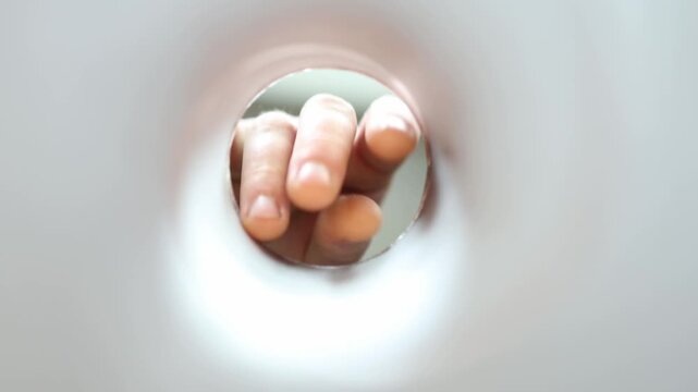 Person reaches deep into a chip can searching for another bite showing strong snack craving food temptation compulsive snacking and appetite driven behavior

