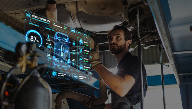 Mechanic inspecting car exhaust with digital vehicle diagnostics. Concept of auto repair, vehicle inspection, smart garage service, predictive maintenance, and car diagnostics.