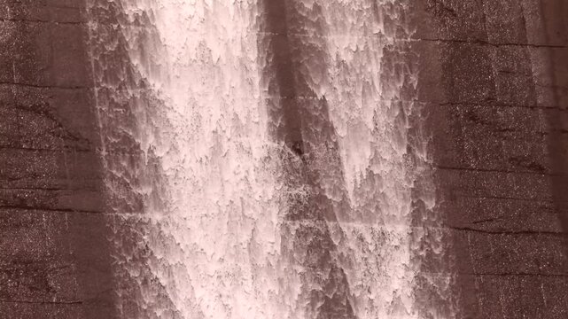 Dam water falling down is dam gate .